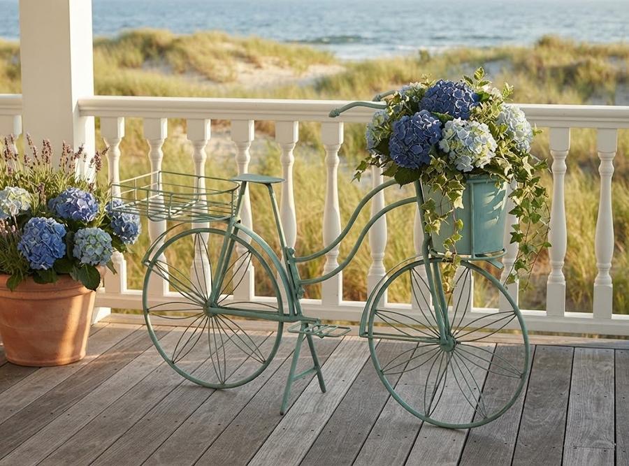 Shabby-chic teal bicycle planter on a porch corner